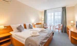 Posteľ alebo postele v izbe v ubytovaní Thermal Hotel Mosonmagyarovar