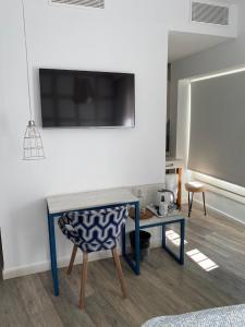 Telewizja i/lub zestaw kina domowego w obiekcie Hotel Boutique Teatro Romano