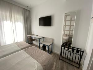 Łóżko lub łóżka w pokoju w obiekcie Hotel Boutique Teatro Romano