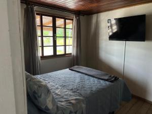 Postel nebo postele na pokoji v ubytování Recanto Pé na Areia SC