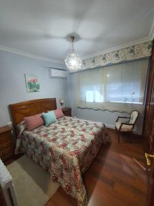 Posteľ alebo postele v izbe v ubytovaní Apartamento Turístico Menéndez Pelayo -Vigo