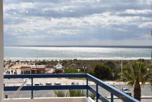 a view of the ocean from the balcony of a condo at Casa Azul in Monte Gordo