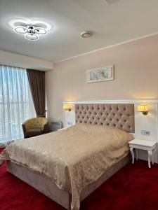 Postel nebo postele na pokoji v ubytování Mark Plaza Hotel + 37 fotografií