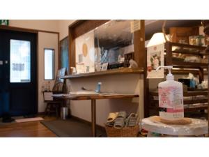 a room with a bottle of alcohol on a table at Garden Villa Shirahama - Vacation STAY 59275v in Shimoda