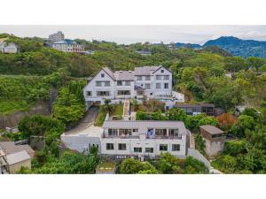 an aerial view of a large white house at Garden Villa Shirahama - Vacation STAY 59290v in Shimoda