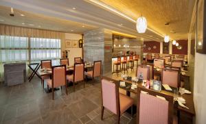 Veitingastaður eða matsölustaður á Raviz Center Point Hotel