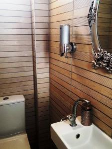 a bathroom with a toilet and a sink and a mirror at Best Location in Bodrum Center in Bodrum City