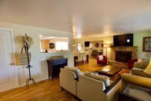 a living room with a couch and a fireplace at Centrally Located Redmond Retreat with Pool Table in Redmond