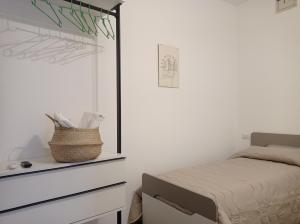 a bedroom with a bed and a mirror at Nonna Sicula in Agrigento