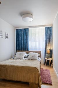 Łóżko lub łóżka w pokoju w obiekcie Apartament Pod Dwójką