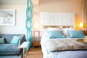 Кровать или кровати в номере Relais et Châteaux Thalasso & Spa Ile de la Lagune