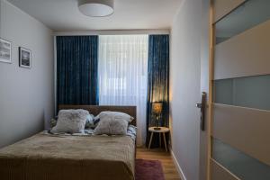 Łóżko lub łóżka w pokoju w obiekcie Apartament Pod Dwójką