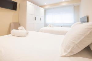 Postel nebo postele na pokoji v ubytování Apartamento Premio Real
