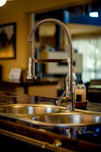 a kitchen sink with a chrome kitchen faucet at Villa Boa Vista in Madalena