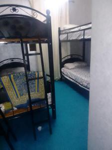 Ein Etagenbett oder Etagenbetten in einem Zimmer der Unterkunft D5 BELLA VISTA Cabo Negro Martil