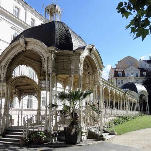 a large gazebo in front of a building at Apartment Bohemia in Karlovy Vary