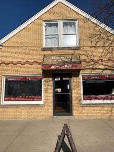 a store front of a brick building with a window at 15 min Ohare/Rivers Casino/Downtown & Parking2 in Chicago