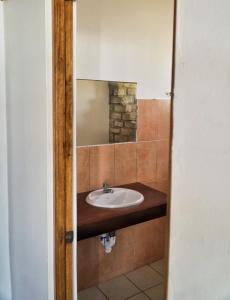 a bathroom with a sink and a mirror at Mancora Soul in Máncora