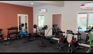 a gym with a bunch of bikes in a room at Aqua view Beach Apartment in Banjul