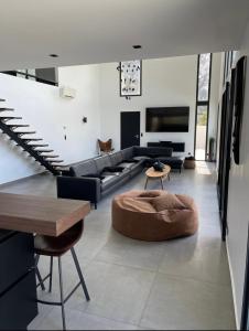 a living room with a couch and a table at Villa EDEN in La Roquette-sur-Siagne