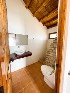 a bathroom with a toilet and a sink at Mancora Soul in Máncora