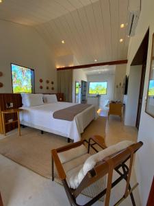 a large bedroom with a large bed and a couch at Villa Canziani & Donato in Pôrto de Pedras +160 photos