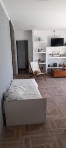 a bedroom with a bed in the middle of a room at Hermosa Casa Quinta en Junin in Junín