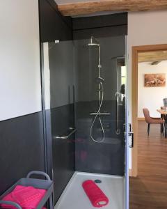 a bathroom with a shower with a glass door at The Stables and The Tackroom at Castle Chase, Ayston 