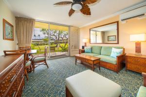 a living room with a couch and a table at Napili Shores Maui by OUTRIGGER - No Resort & Housekeeping Fees in Lahaina