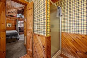 a room with a sliding glass door in a cabin at The Mountain Farmer in Sevierville