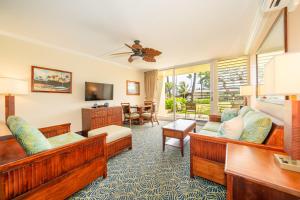 a hotel room with couches and a living room at Napili Shores Maui by OUTRIGGER - No Resort & Housekeeping Fees in Lahaina