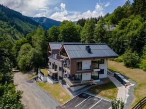 an aerial view of a house with a metal roof at Schmittenblick 2 in Viehhofen