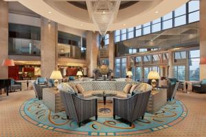 a lobby of a hotel with chairs and a table at Sheraton Ankara Hotel & Convention Center in Ankara