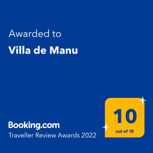 Ett certifikat, pris eller annat dokument som visas upp på Villa de Manu