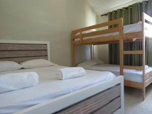 Postel nebo postele na pokoji v ubytování Bavaro Hostel + 6 fotografií