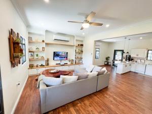 a living room with a couch and a tv at Westend House Newly Renovated 3 Bedroom in Petit Valley