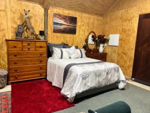 Säng eller sängar i ett rum på Waiora la grange cottage