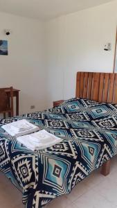 Ein Bett oder Betten in einem Zimmer der Unterkunft La Estancia de Runtún Km 7