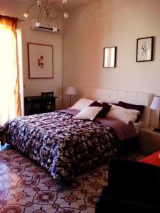 Ένα ή περισσότερα κρεβάτια σε δωμάτιο στο B&B A Casa Di Mario Scafati