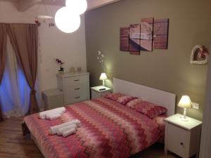 Postel nebo postele na pokoji v ubytování Spegni La Luce b&b