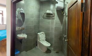 a bathroom with a toilet and a sink at Ngọc Mai Hotel in Da Lat