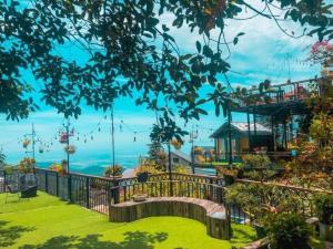 a garden with a view of the ocean at Roses Villa Tam Dao - Venuestay in Tam Ðảo
