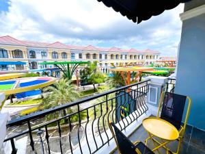 a balcony with a view of a resort at RAINBOW Motel in Phú Quốc