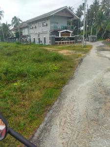 a house on the side of a road at Airport Kota Bharu Transit Inn in Kota Bharu