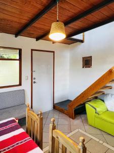 a room with a bed and a couch and a staircase at Departamento independiente Amueblado Tule Oaxaca room in Santa María del Tule