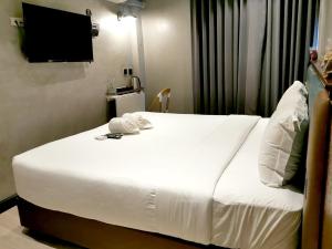 Postel nebo postele na pokoji v ubytování Narawad Boutique Hotel
