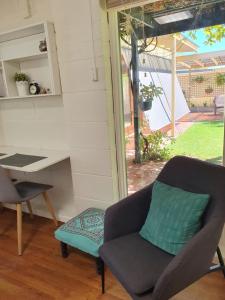 a desk and a chair in a room with a desk and a chair sidx sidx at Newly rennovated Granny flat in leafy foothills. in Clapham