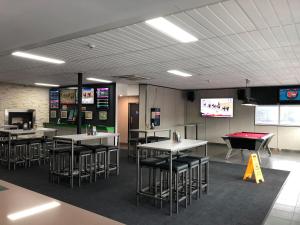 a gaming room with tables and a pool table at Brighton Hotel Motel in Pontville