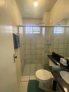 a bathroom with a shower and a toilet and a sink at Apto refúgio 301 em São Luís/MA (inteiro) in São Luís