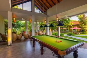 a pool table in the middle of a room at Chaarya Resort & Spa in Tissamaharama